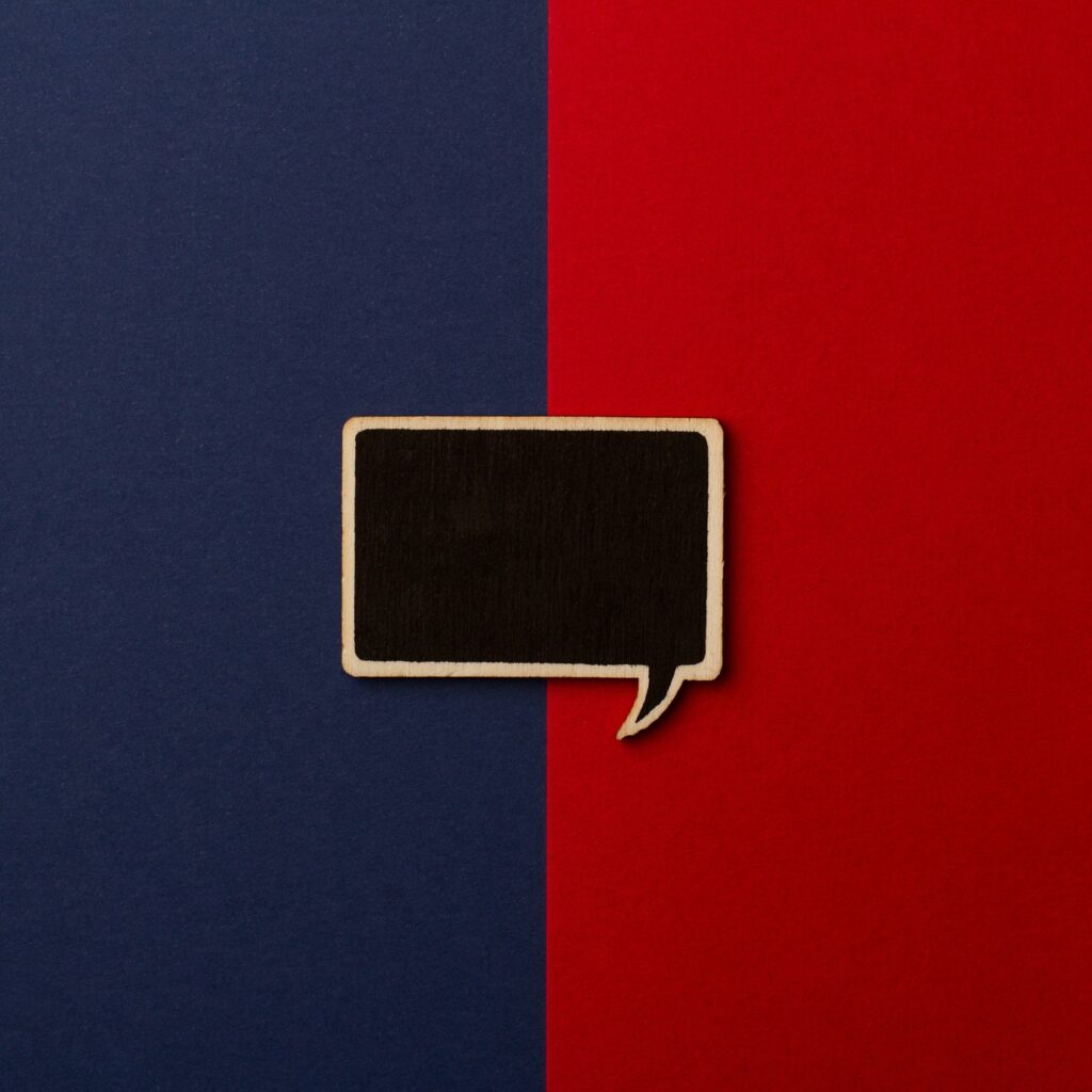 Square empty chalkboard wooden speech bubble on red and dark blu